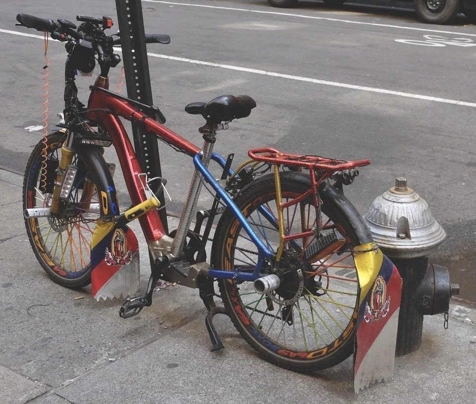  Unlike some other delivery bikes we noted, these customized bikes were well lit at night.  Note, three locks! 