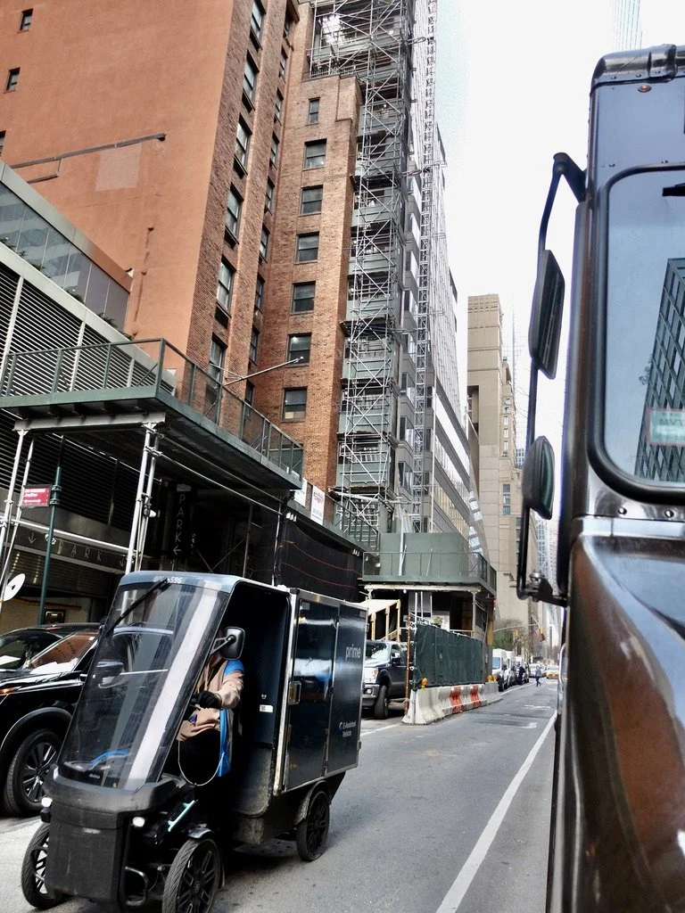  Amazon delivery electric mini vehicle. Behind &amp; to the left, with the scaffolding, is the under renovation Hotel Elysée where we used to stay. 