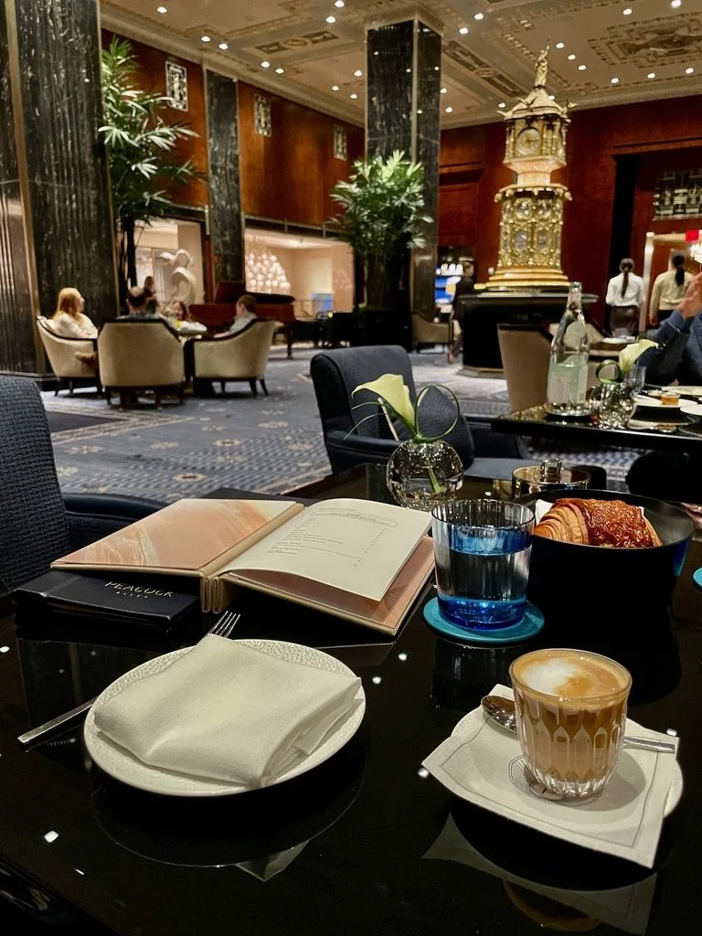  We decided to sit in the lobby &amp; have coffee.  It was quite a splurge but delightful as we met the manager of the lobby &amp; Noel took us on a tour.  Behind the folks sitting at the table on the left is Cole Porter’s piano. 