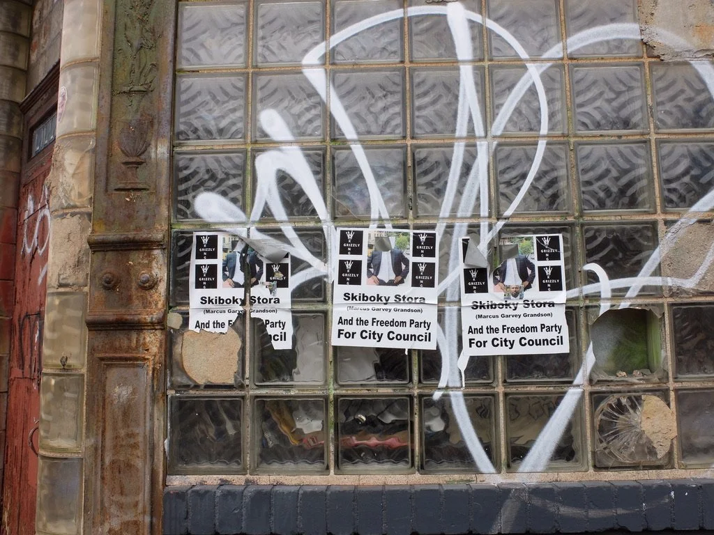  On the window of the Noble Sign Co.  I wondered why his head was removed &amp; found  this…  Stora “allegedly committed a series of hate-motivated incidents against several individuals based on their perceived gender, race and religion.”   