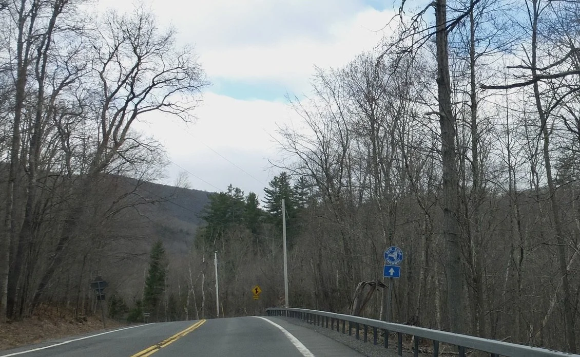  Rte. 214.  Still a long way from here to the New York Thruway.  I always liked that circa late 1950’s early 1960’s iconic blue sign. 