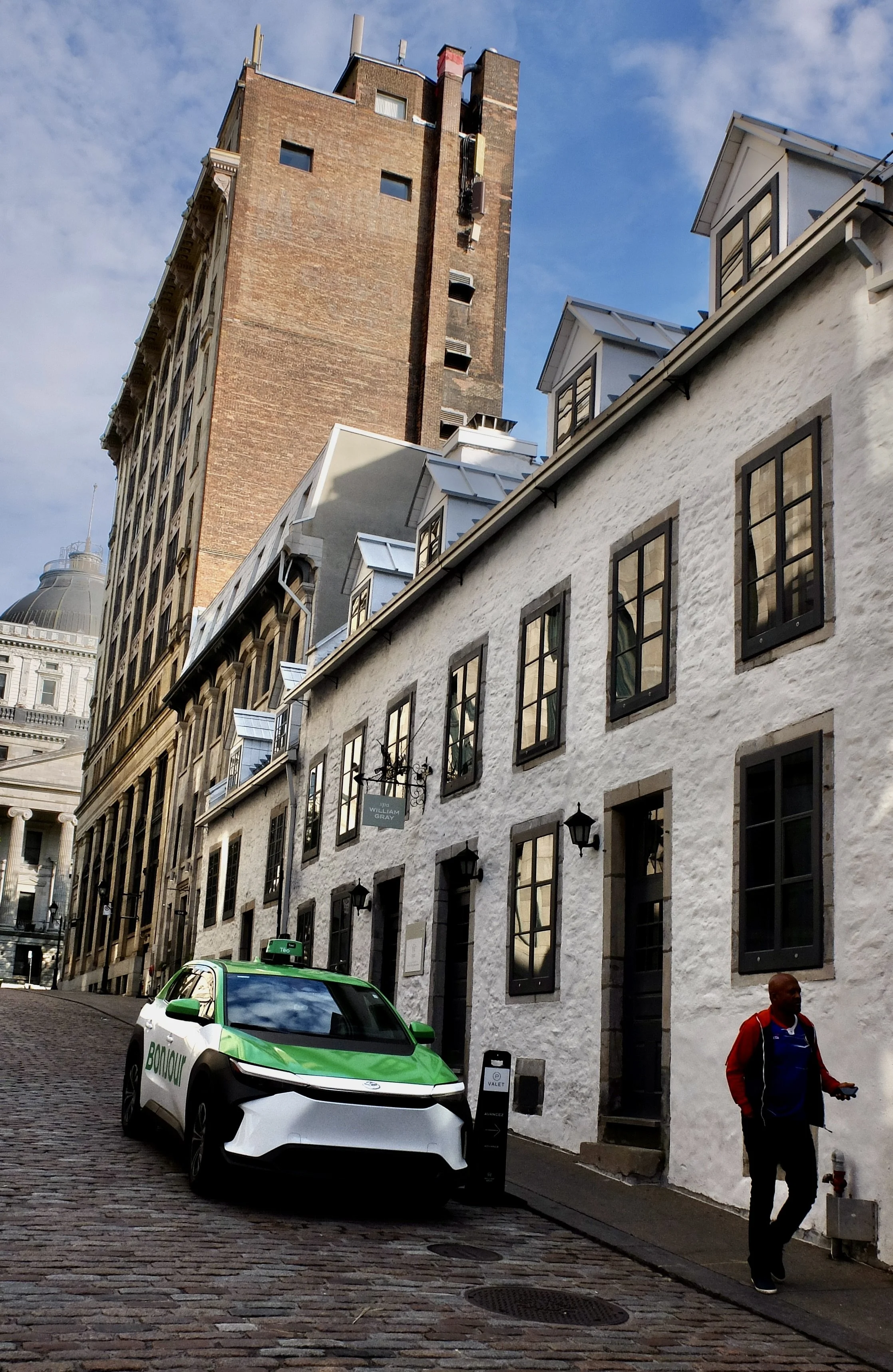  Taxi cab driver outside the Wm. Grey Hotel , Montréal.  Love the taxi company’s name, BONJOUR. 