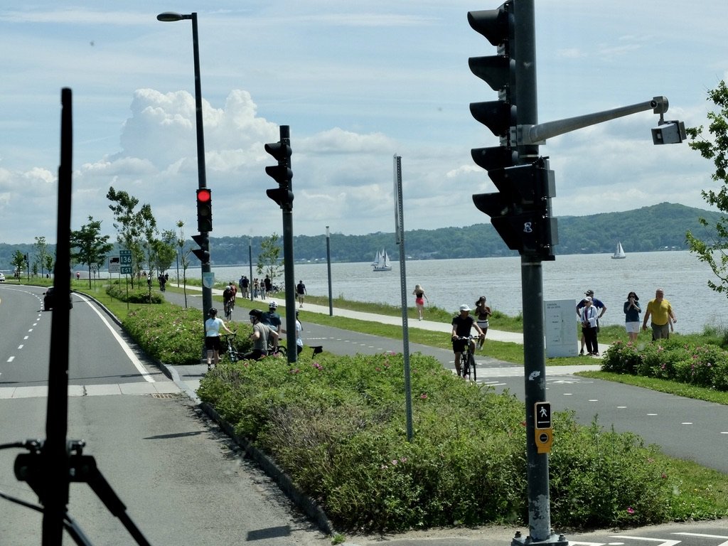  Folks enjoying a beautiful day on the Lake Ontario path in Québec City. 