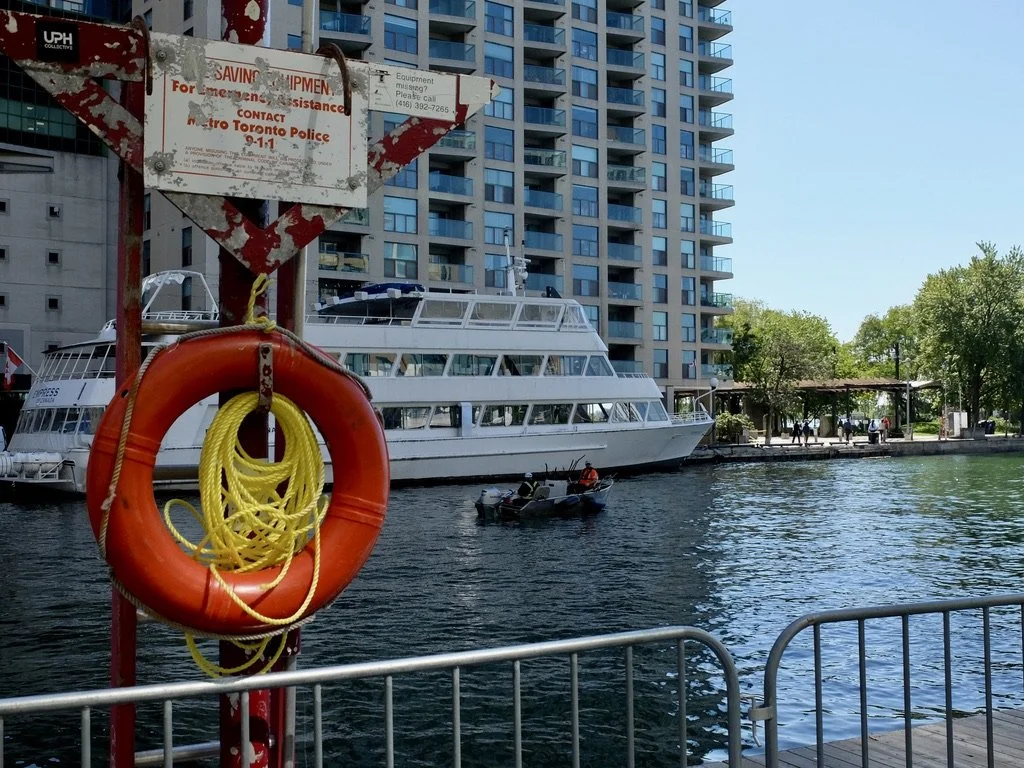  Toronto Harbor.  These guys came to each dock to rake up garbage.  Their boat was filled with debris that was all branches &amp; such...no trash!  No plastic, no cans, no papers, no bottles, no bodies… 