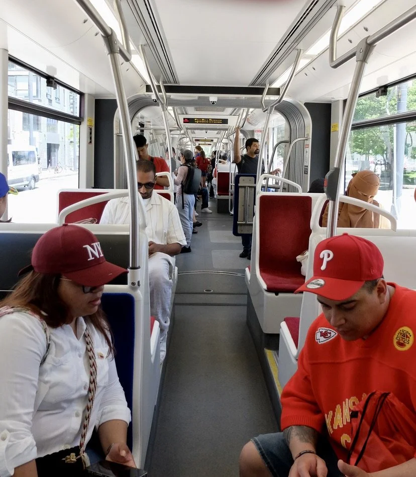  People on street car. 