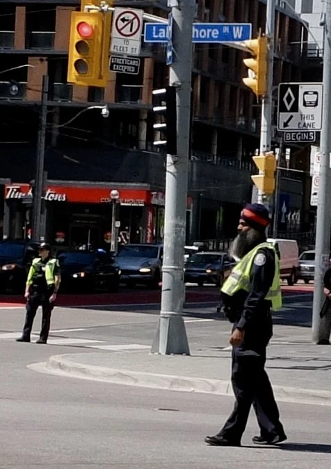  Toronto policeman with big beard.  Police were a big presence around the waterfront for the Fédération Internationale de Football Association  ( FIFA) games. 