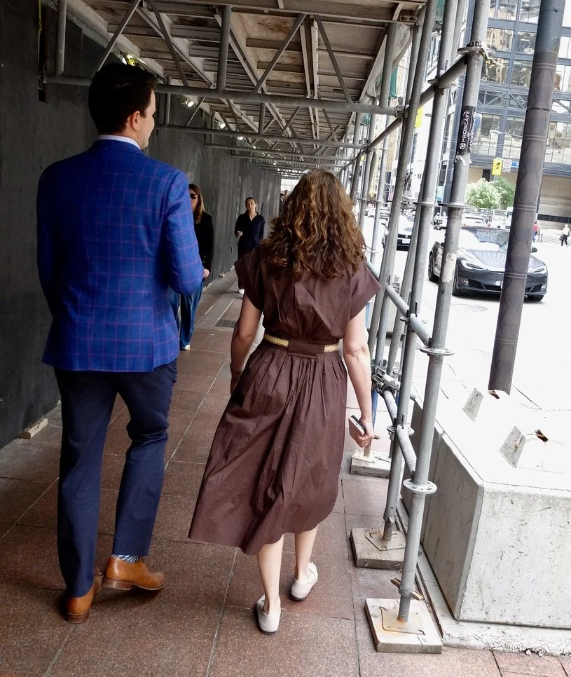  Workers downtown wore well tailored clothing.  
