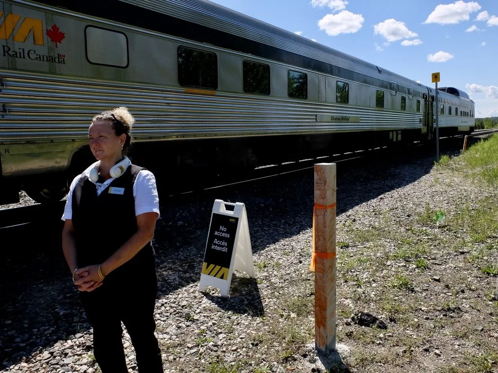  A not so helpful attendant while we had a long layover, (why??? we never learned) in Hornerpayne, "The Geographical Centre of Ontario."  We were told we could get off &amp; walk around for a few minutes… that turned into almost two hours.   She woul