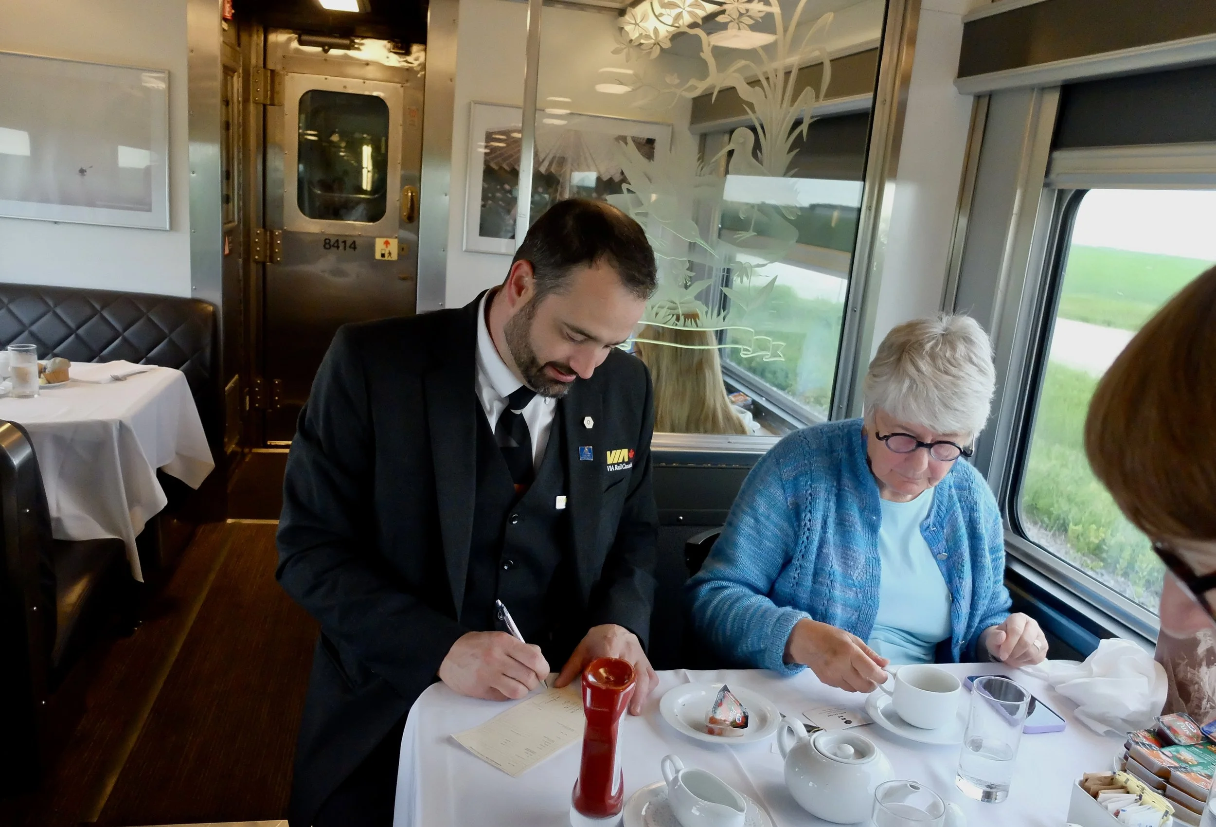  At 6:30 AM, Gabriel helping our new friend Lorileigh  from Halifax figure out her journey when we were told the train would not continue. 