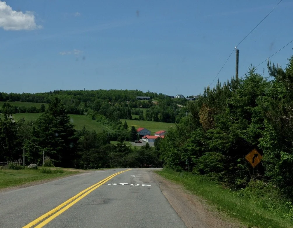  Best of Prince Edward Island Tour.  It was the 2nd tour of the day for our driver/guide.  He was a bit bored, but okay.  He hadn't cleaned the windshield from the morning's tour when it had rained. 