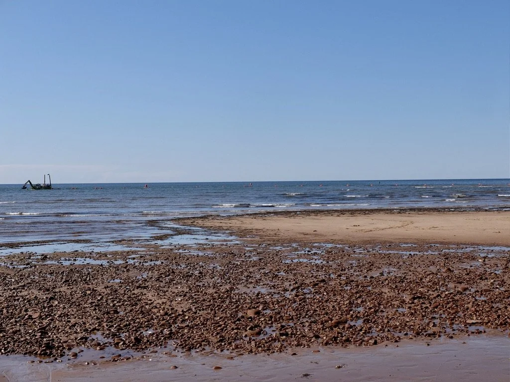  Dredging a channel in the Gulf of St. Lawrence for boat passage.  Seen from Gulf Shore Parkway, Prince Edward Island National Park, Covehead, PEI.   Best of Prince Edward Island Tour.  