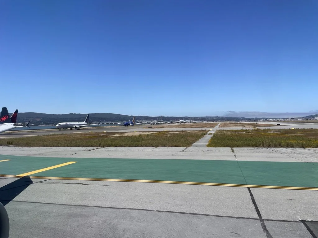  At SFO, aboard Air Canada en route to Halifax via Montréal.  We were told there were delays due to storms.  Look at this lineup of airplanes waiting for takeoff!  We were delayed coming into Montréal (YUL).  Luckily our flight from YUL to Halifax wa