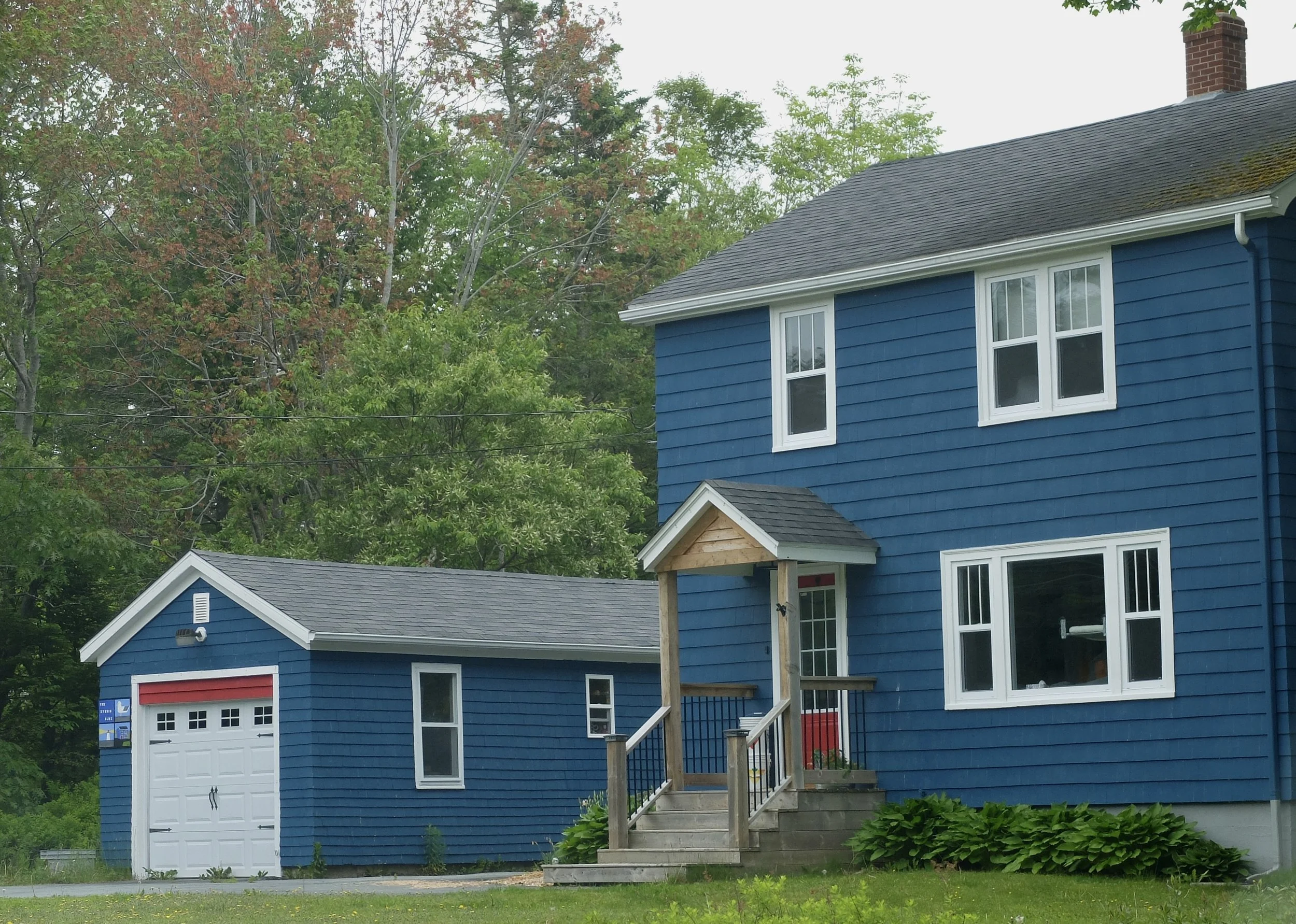  Road to Peggy's Cove.   Note the high garage door.  Likely there’s snow removal equipment in there. 