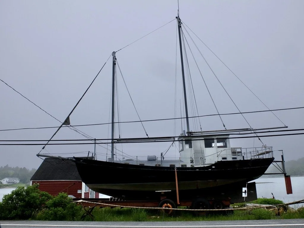  Road to Peggy's Cove - One of many boats we observed displayed on the land. 