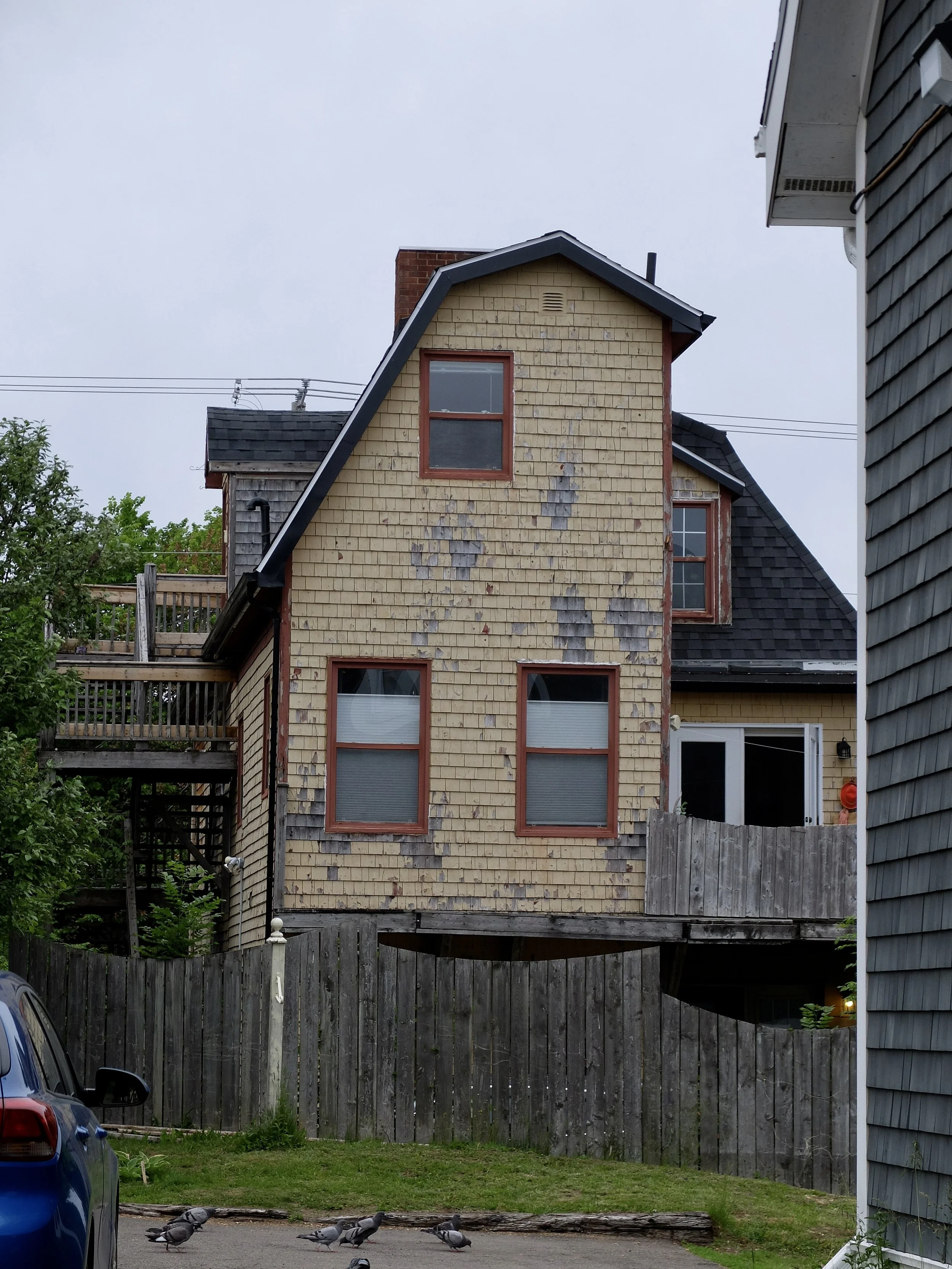  We didn’t get to see the back of a house often.  Also beat up by the weather &amp; salt air.  Charlottetown, PEI. 