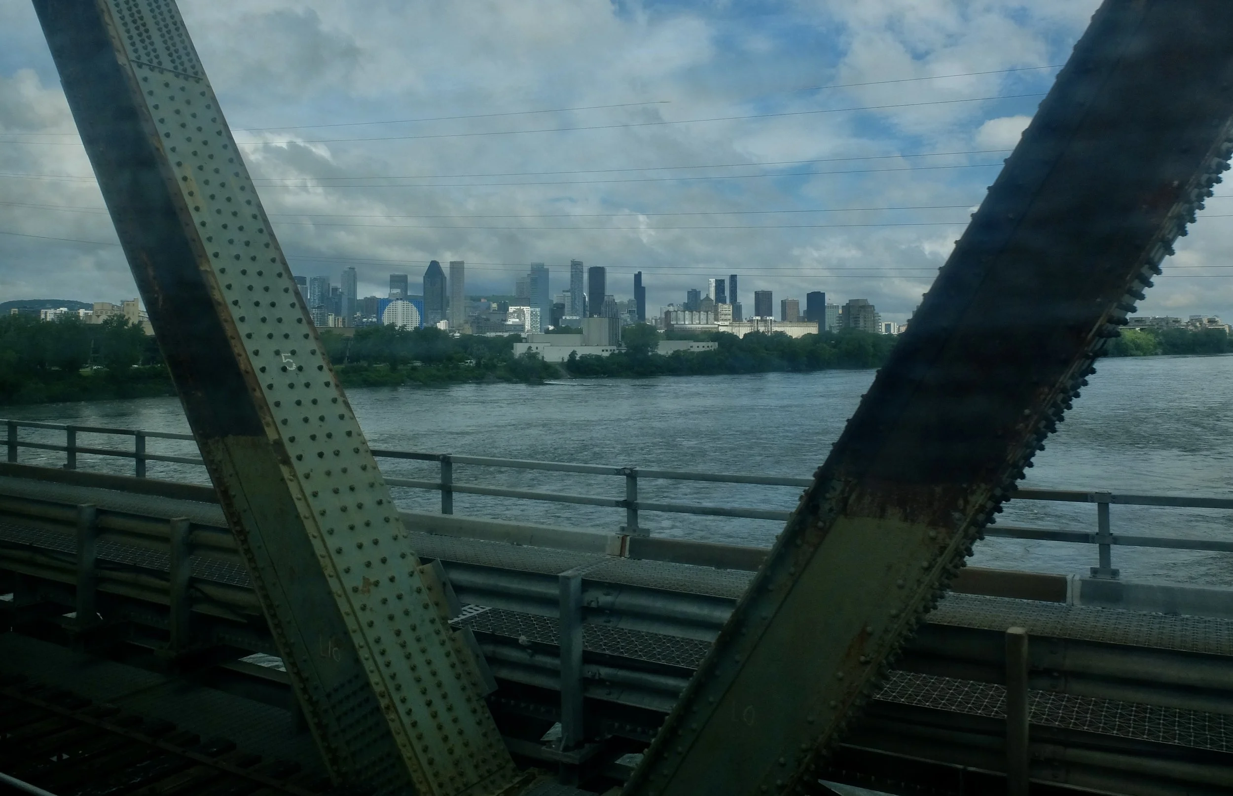  Montreal from The Victoria Bridge.  VIA sleeper train to Montréal. 