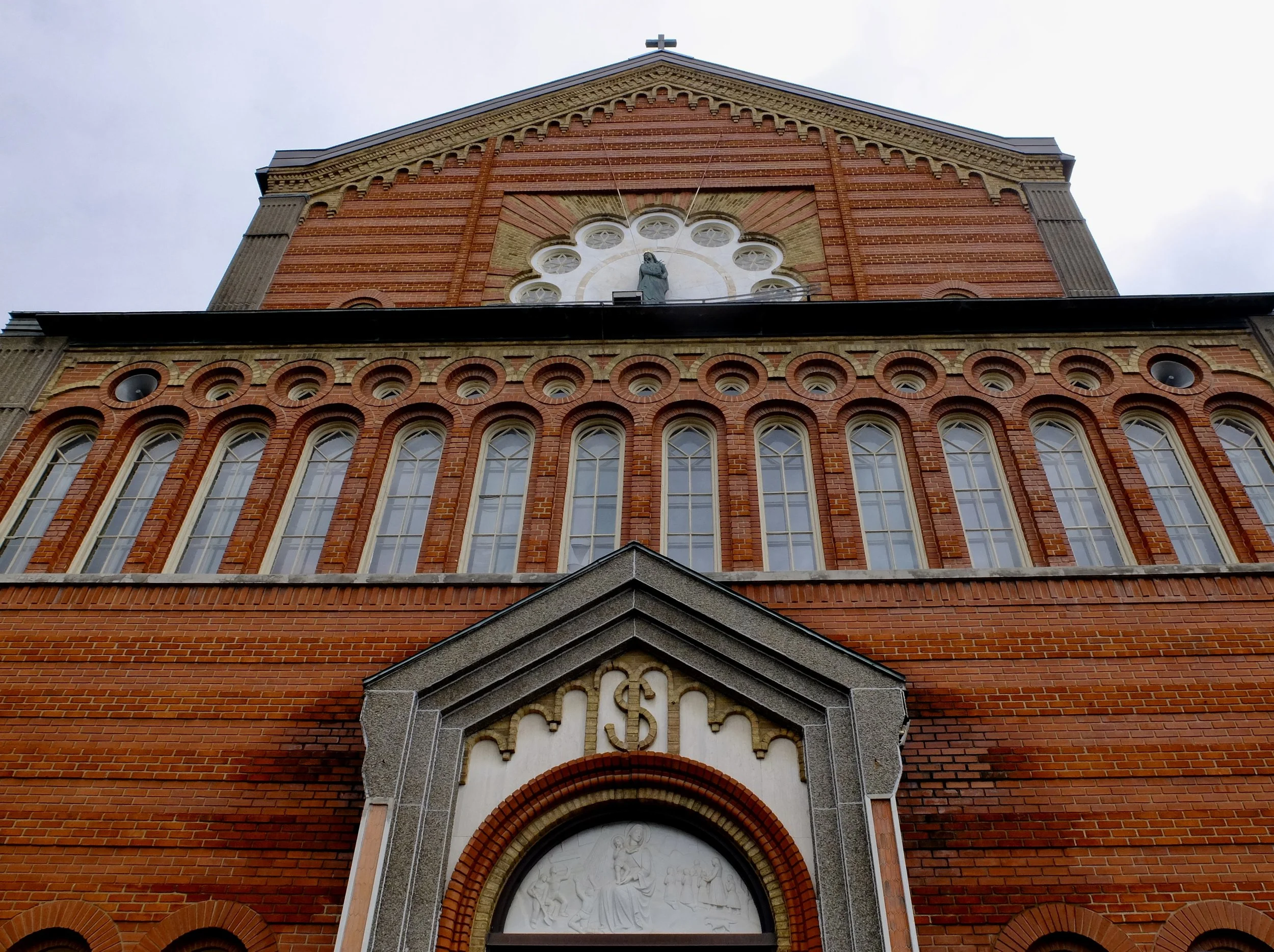  Across the street, Our Lady of La Difesa. “This church in Little Italy is decorated with controversial Fascist art and serves as one of the neighborhood's chief landmarks.”  Beyond the Market walking tour with Jesse  