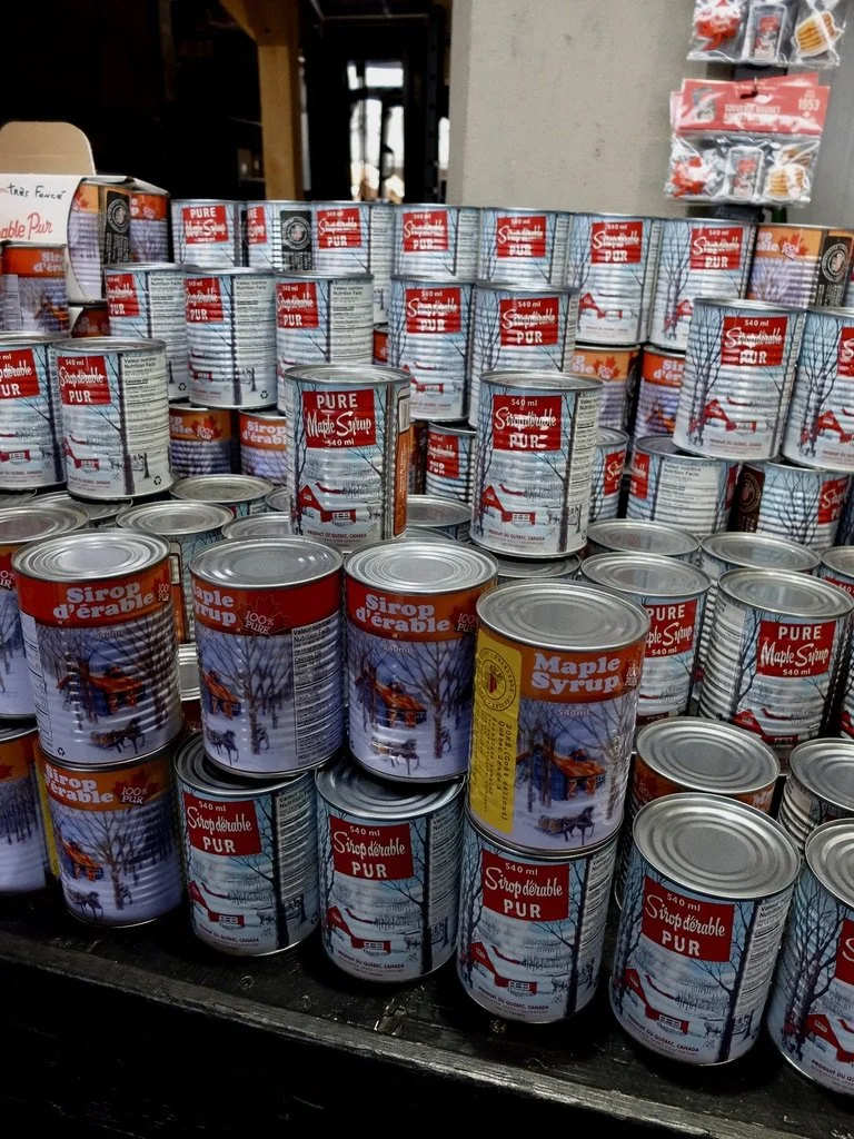  Jesse said that glass bottled maple syrup is for tourists.  The tins are for the  Québécois people  use maple syrup in everything.  Jesse didn’t know what a church key was.   Jean-Talon Marke t.  Beyond the Market Montréal walking tour with Jesse. 