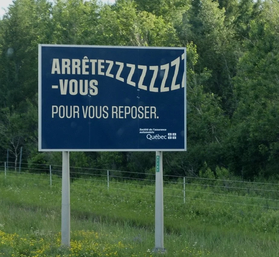  Some good advice for the drowsy driver:    "STOP  AND REST."  Highway approaching Montréal. 