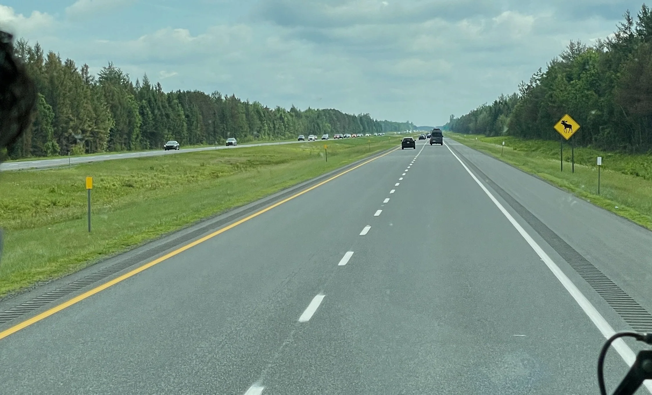  Again a moose alert. Moose sign in distance on the drive back to Montréal.   