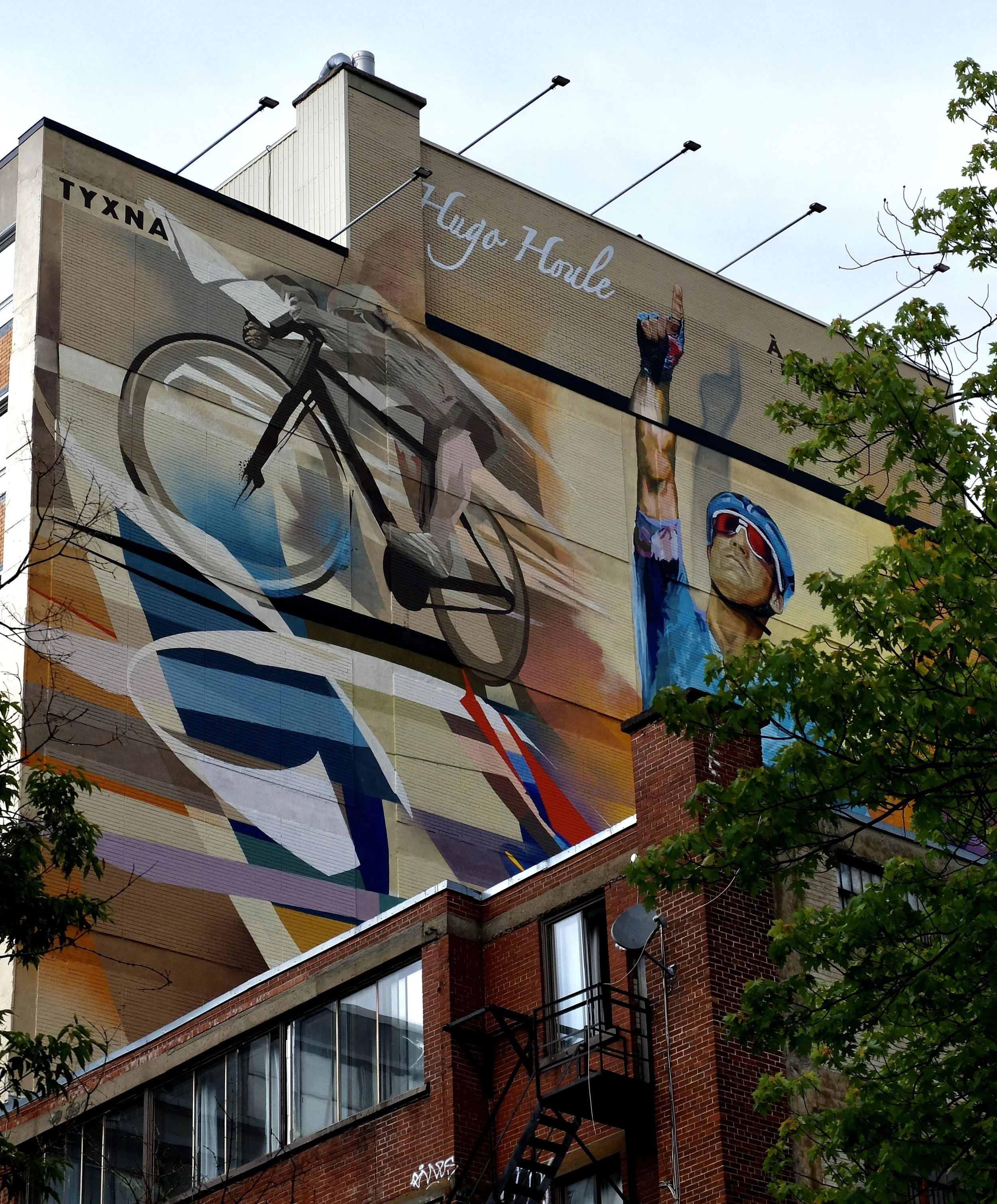  “A massive new mural in Montreal’s Plateau neighbourhood is turning heads—and telling a story. The beautiful new piece is painted across a 10-storey building on Mont-Royal Avenue. The artwork shows Israel – Premier Tech’s  Hugo Houle  po inting sky 