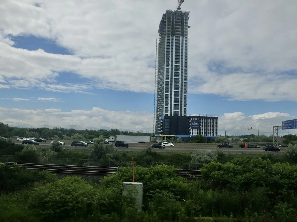  A Tribute Communities new project on the outskirts of Toronto near a rail station for an easy commute downtown.  Tribute is building residential housing all across the Greater Toronto Area (GTA).  Seen from train Montréal to Toronto. 