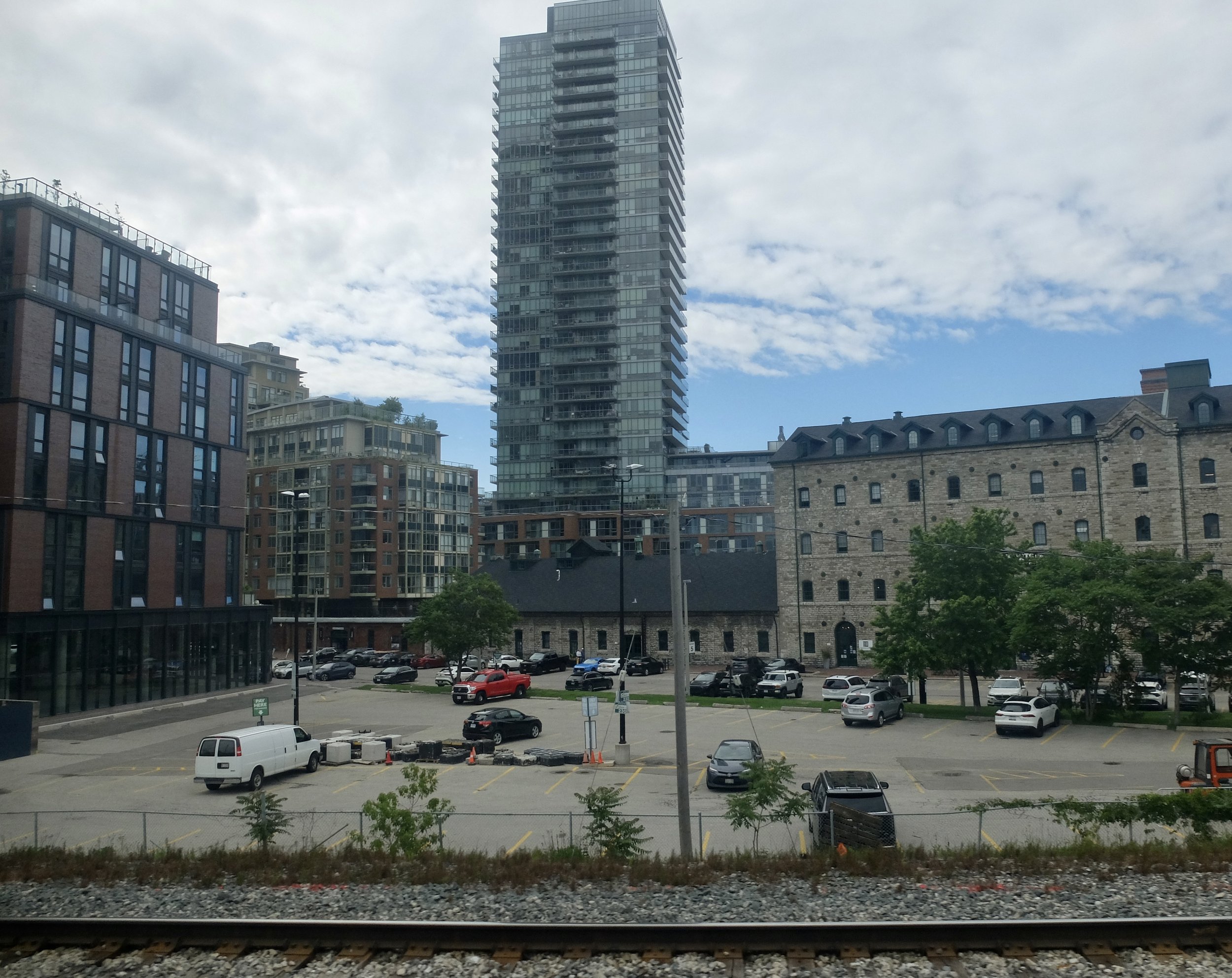  "With Toronto’s ongoing construction boom, nine supertall skyscrapers are now in development, with three already under construction."  Entering Toronto on train from Montréal. 