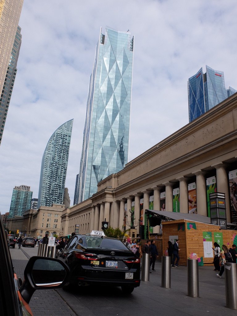  Union Station Toronto in the foreground.  The curved building is the ca. 2018 Tower Automotive Building anchored by the Museum of Contemporary Art. 