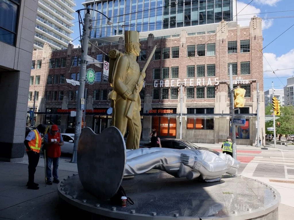  Fleet St. &amp; Bathurst Streets -  " Monument to the War of 1812 , also called  Toy Soldiers , …unveiled in 2008,…includes two Styrofoam sculptures over a stone plinth, and commemorates the successful defence of British North America against Americ
