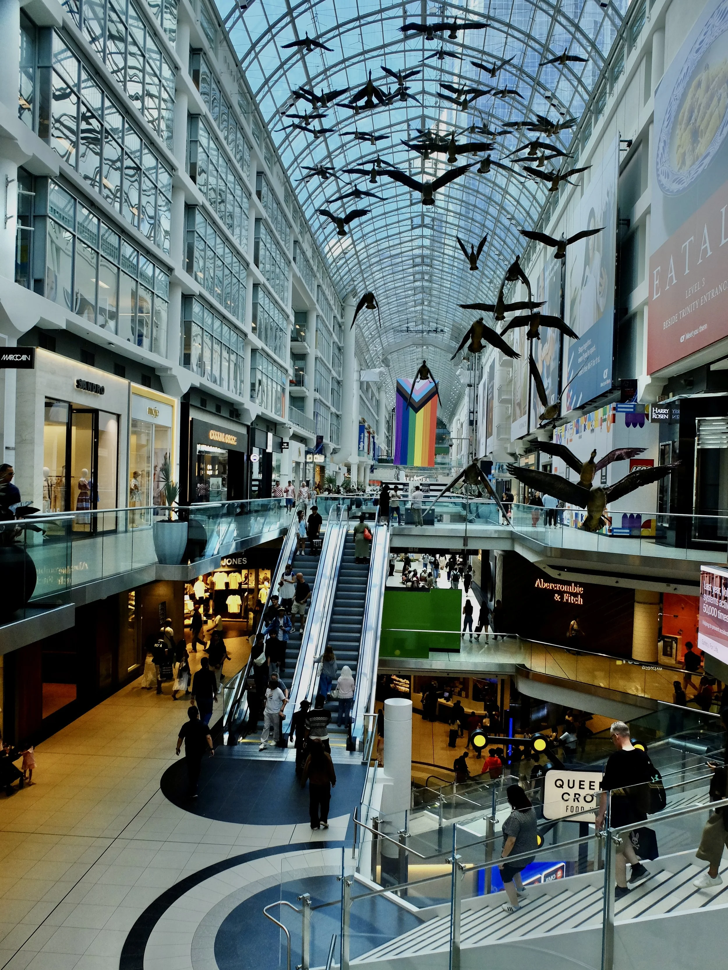  Opening in 1977, Eaton Centre "... attracts more visitors than any of Toronto's tourist attractions because it sits on top of two subway stations in downtown Toronto and is close to Union Station. It is North America's busiest shopping mall when one