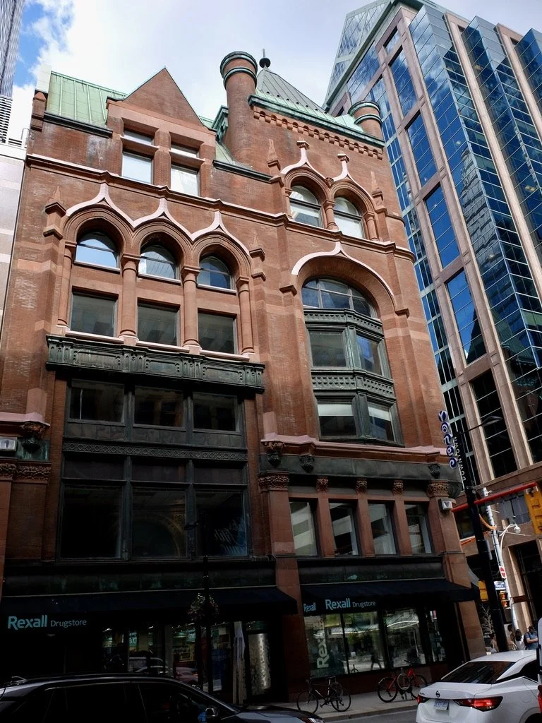  “The Confederation Life Building, a seven-floor Romanesque Revival office building…  Completed in 1892, it was designated a historic property by the City of Toronto… in   1975.” 