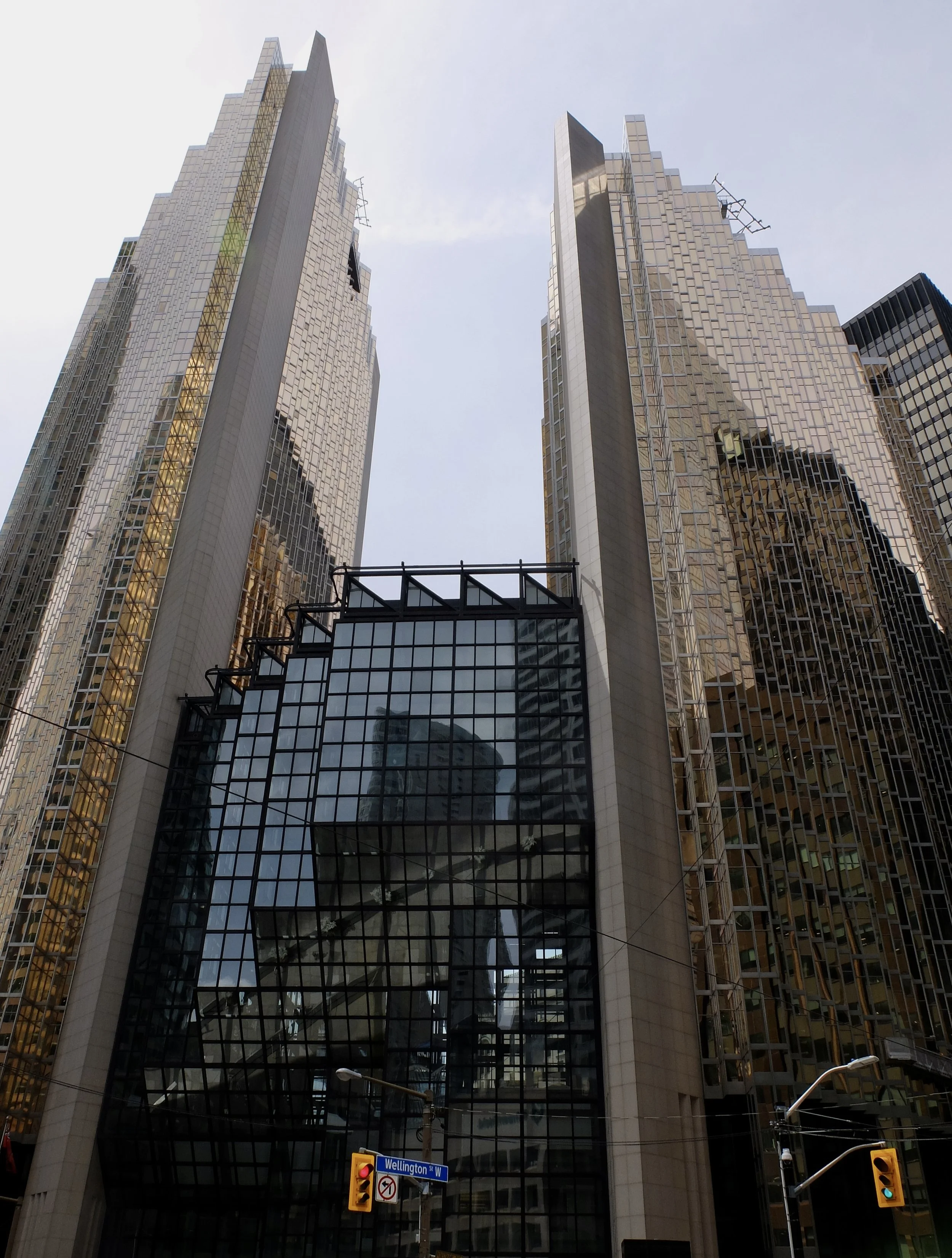  “Simcoe Place is an office building and shopping centre in Toronto, Ontario, Canada. The tower is 148 metres metres with 33 floors. It was completed by architects Carlos Ott and NORR in 1995.” 