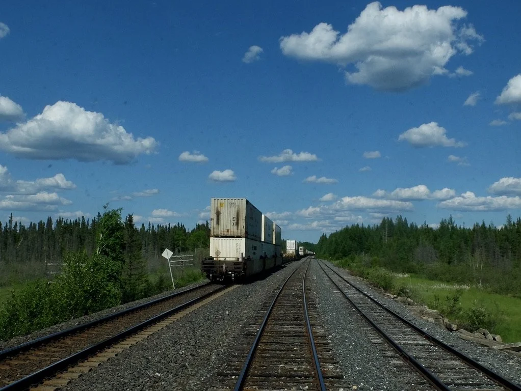  Freight cars on a siding.  Seen from the Prestige Lounge of The Canadian 