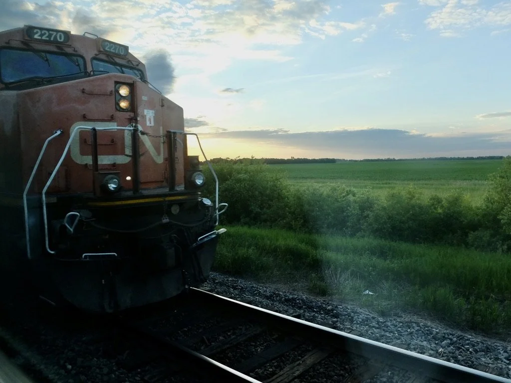  We were on a siding for a long time &amp; a long freight train zoomed by.  We waited for a long time after it had disappeared.  This happened every time we had to be on a siding for a freight train.  It could be 30 minutes total time just sitting on
