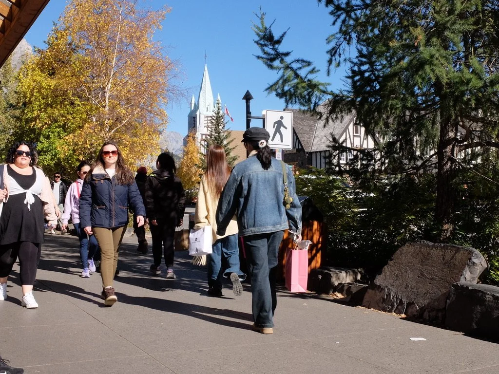  “The Strip” (Banff Ave.) in Banff was crowded with folks of every type on a Sunday afternoon.  I was sitting &amp; sipping a caffè macchiato at Evelyn’s Coffee Bar. Such good people watching. 