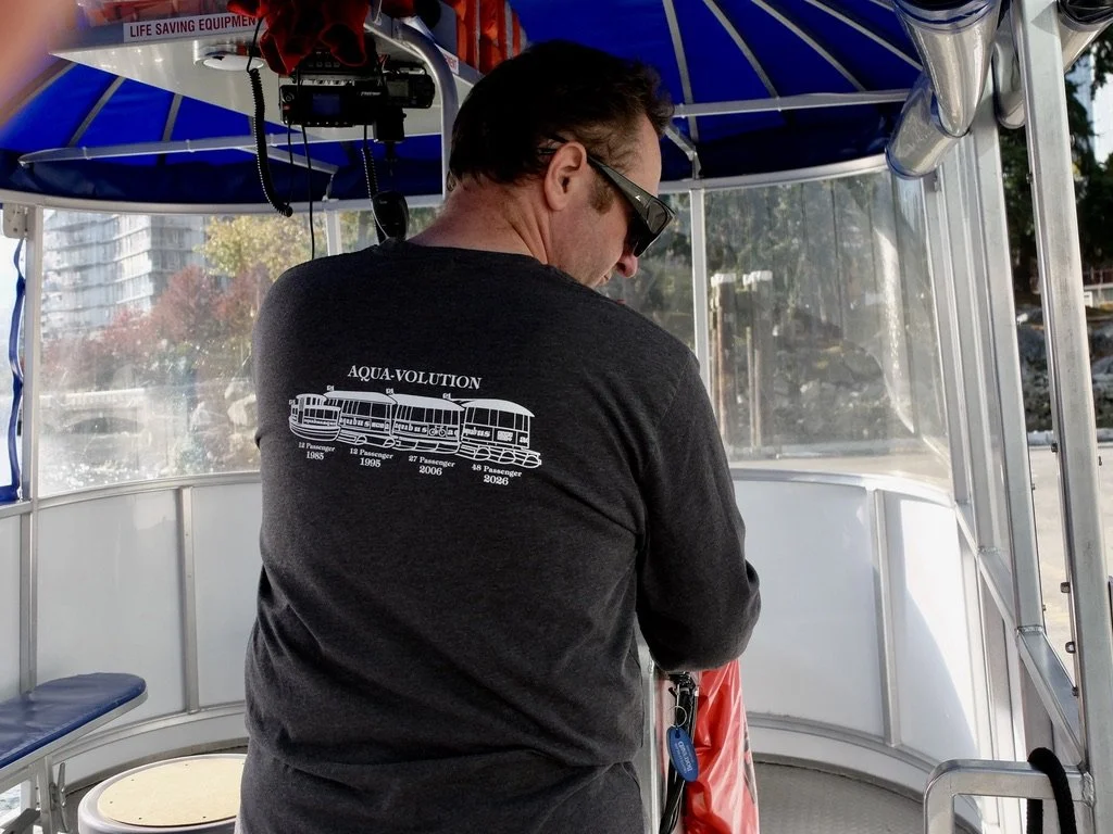  Another person who liked  his job, on the  aquabus  ferry.  Our tiny ferry was too full to pick up some passengers at one dock.  He called in to request a ferry to come &amp; pick them  up.  Aaah, Canada. 