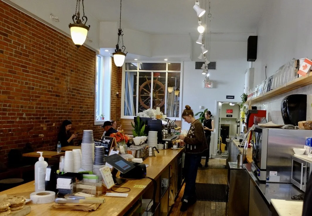  Brian Turko's Milano Coffee Roasters - "World Peace in a Cup."  An excellent caffé macchiato when you need one. Lovely baristas too.  I liked her sweater/   