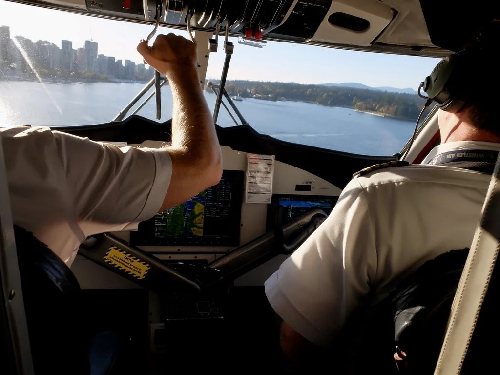  Harbour Air float plane pilots preparing to alight on the water in Vancouver. 