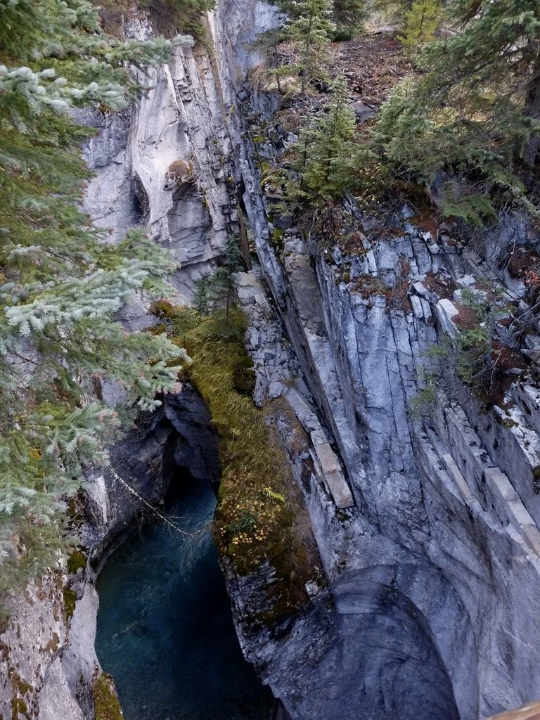  “The bedrock is microcrystalline limestone from ancient marine deposits of the Paleozoic era. This limestone is distinct from the surrounding granitic terrain and is responsible for the canyon’s sheer, chalky-white cliffs and slot-like profile. The 