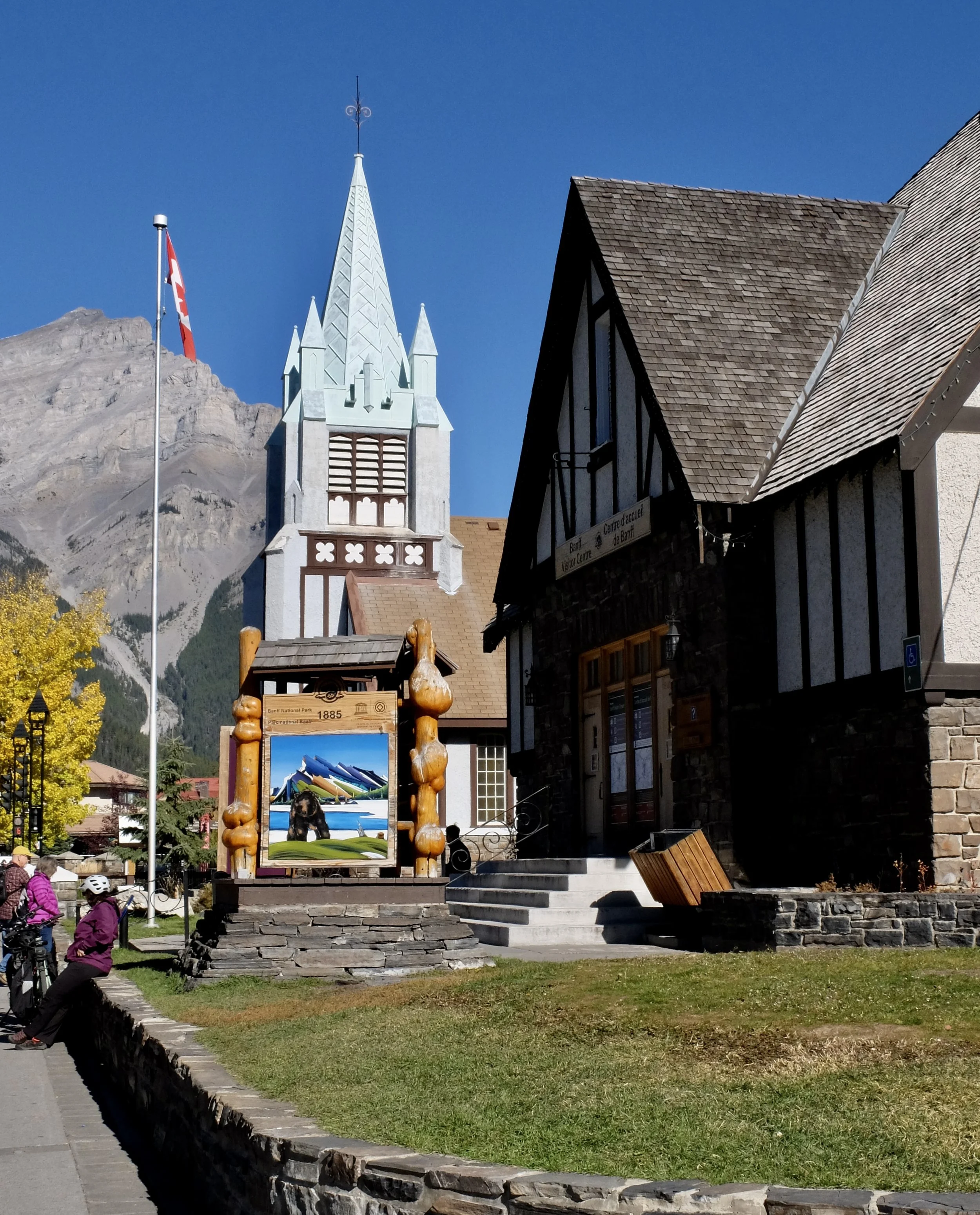  Banff Visitor Centre (“…which is a recognized federal heritage building constructed by the Banff School District between 1939 and 1940”) &amp; circa 1930  St. Paul's Presbyterian Church  along Banff Ave. in downtown Banff. 
