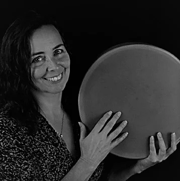 Kristina Sophia (acoustic musician) is a world-traveler, pioneering co-creator of Musical Missions of Peace, and co-star of Singing in Baghdad. She has sung in the Cairo stadium for an audience of 60,000 Egyptians and performed in the war-zones of Iraq with partner Cameron Powers. She has taught singing, healing sound and voice therapy for 15 years and has 2 critically acclaimed CDs.