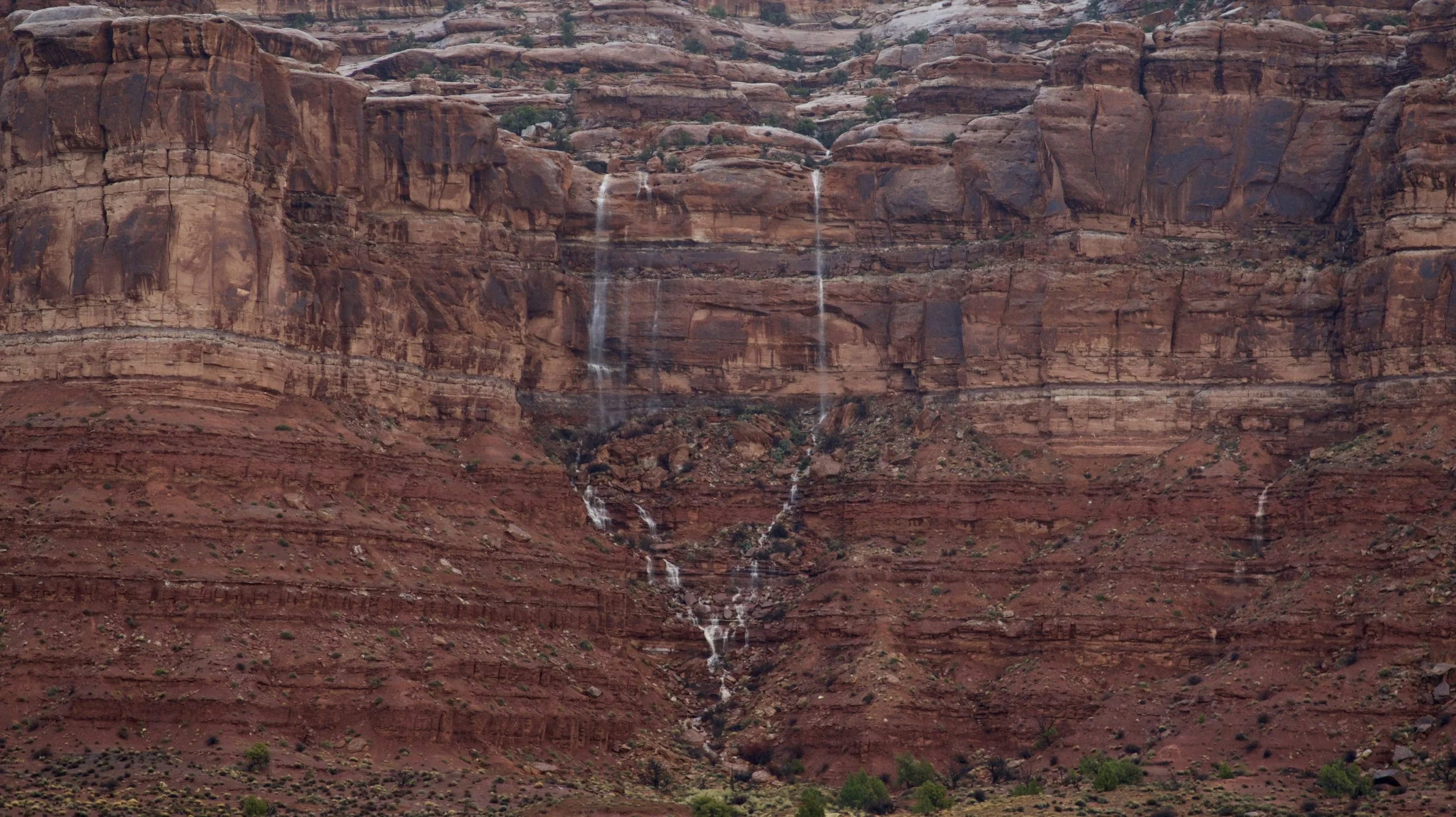 Waterfalls formed from the runoff cascade down the canyon walls.