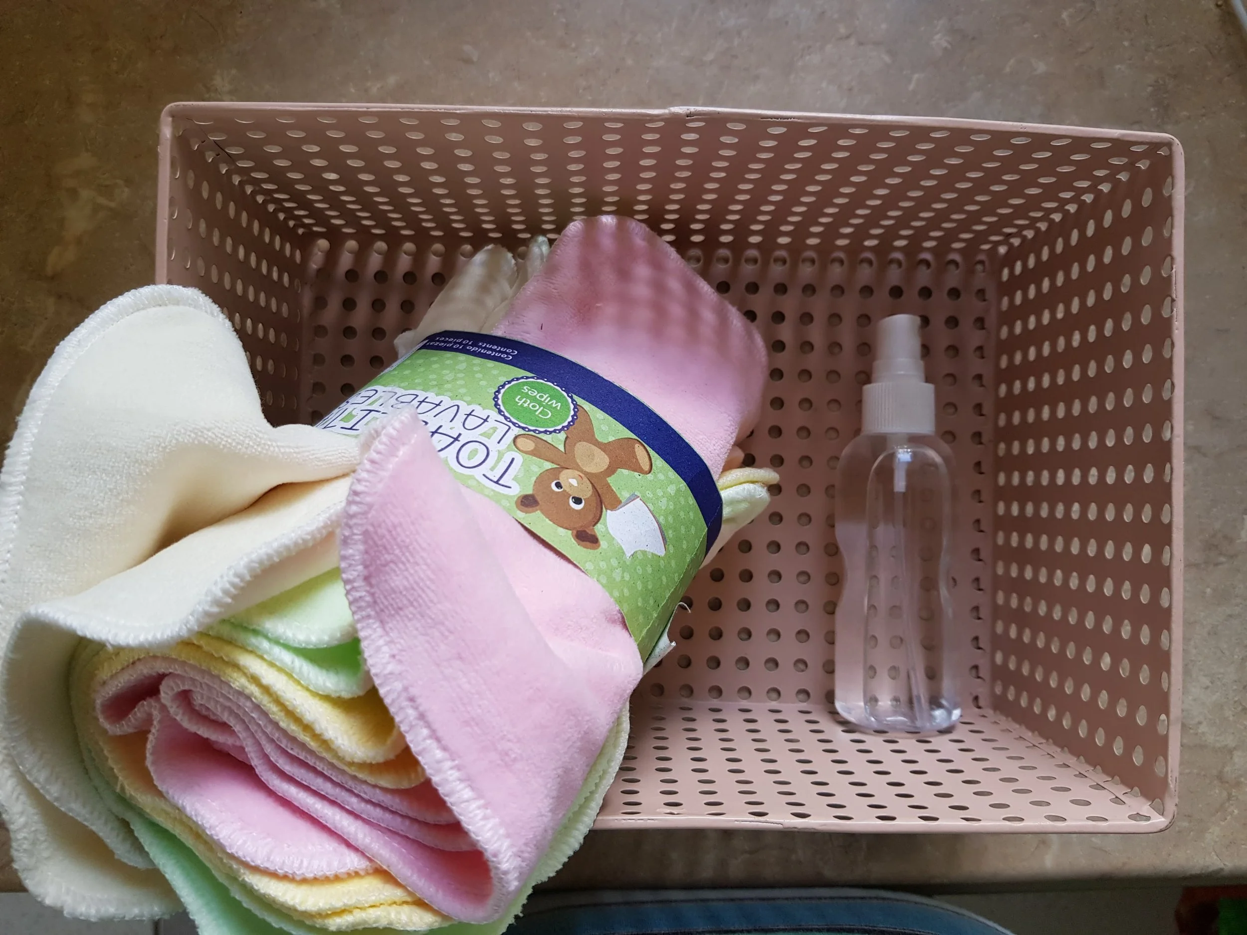 My set up! A metal container to hold everything with cloth wipes (EcoPipo Ireland brand) and a spray bottle to wet as I go!