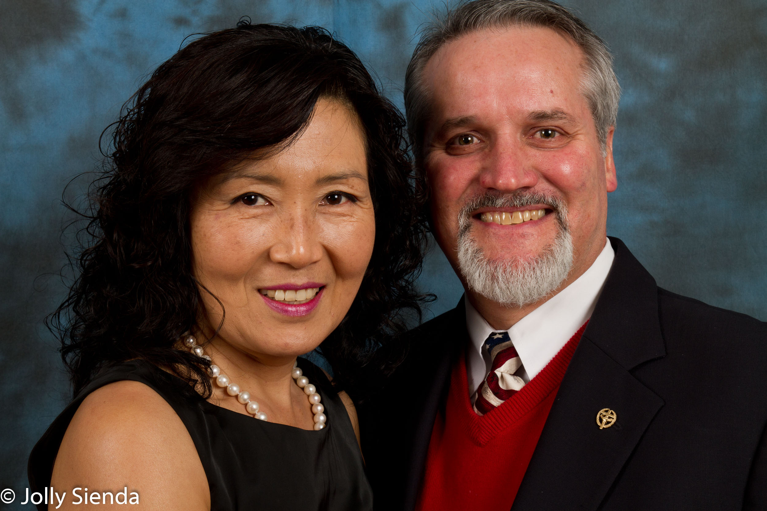 Couples family portrait in a studio setting