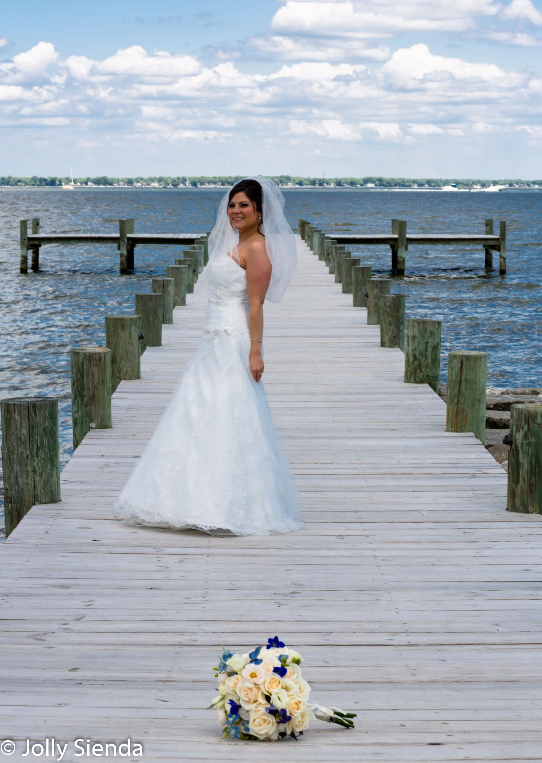 Wedding photography, the bride, the beach, and the bouquet