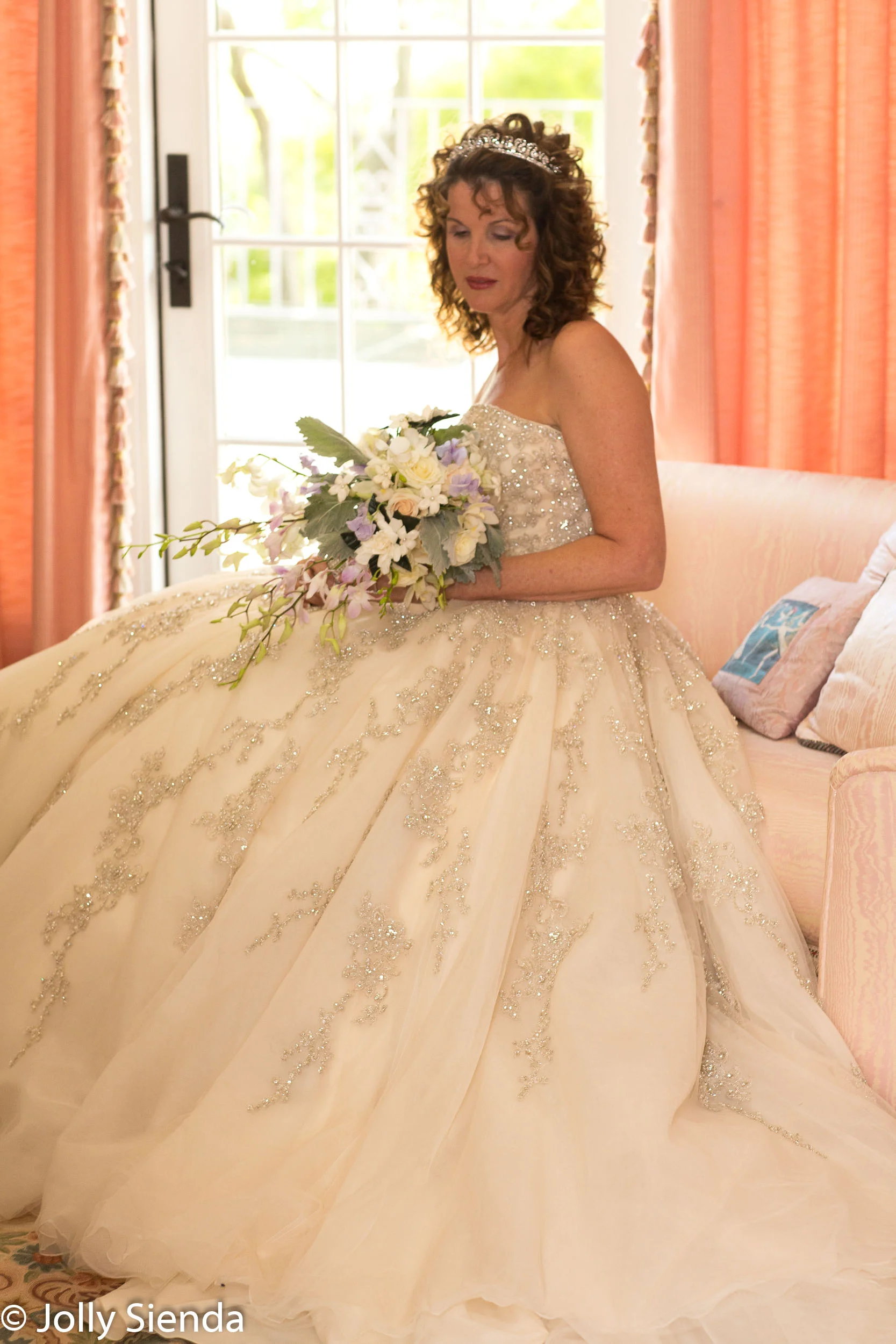 Quite moment for a bride in her wedding dress holding her bouque
