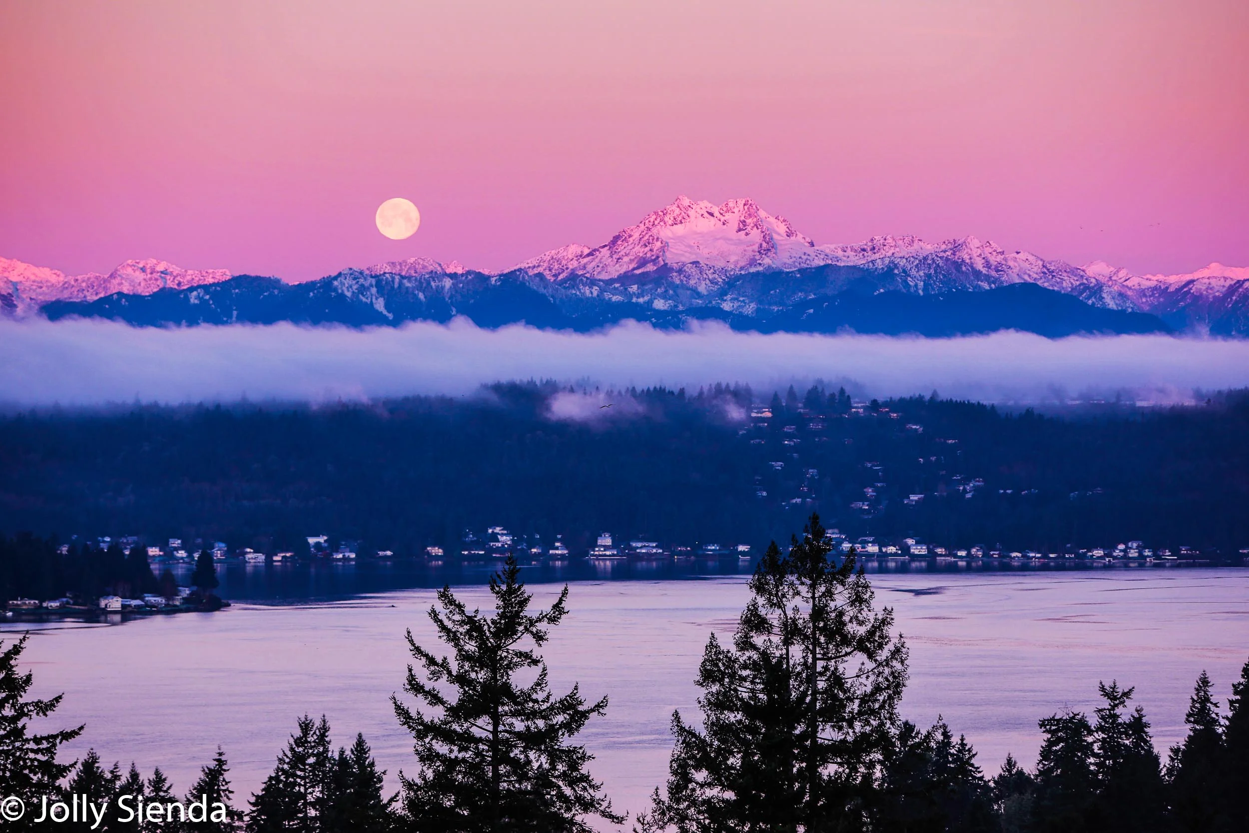 The Brothers mountain and the moon at sunrise over Dyes Inlet