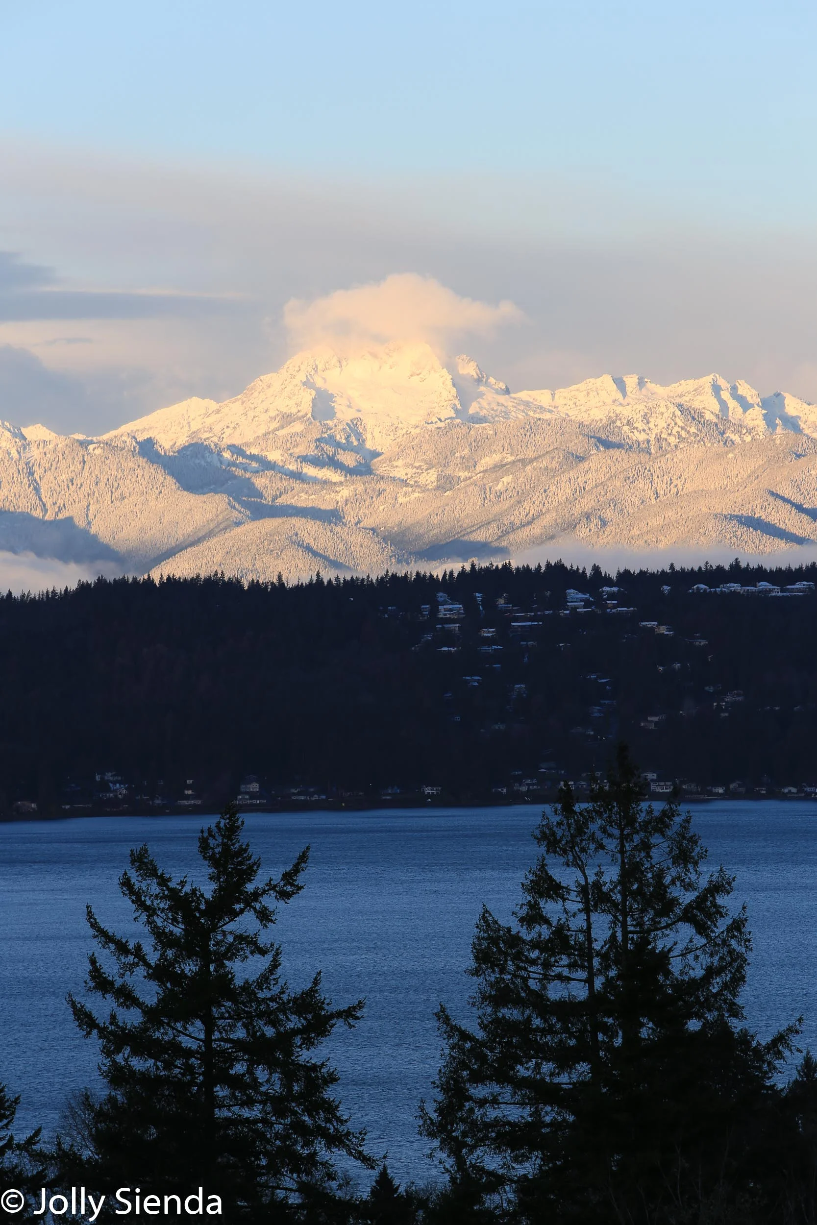 Pink cloud and snow over The Brothers Mountain and the Puget Sou
