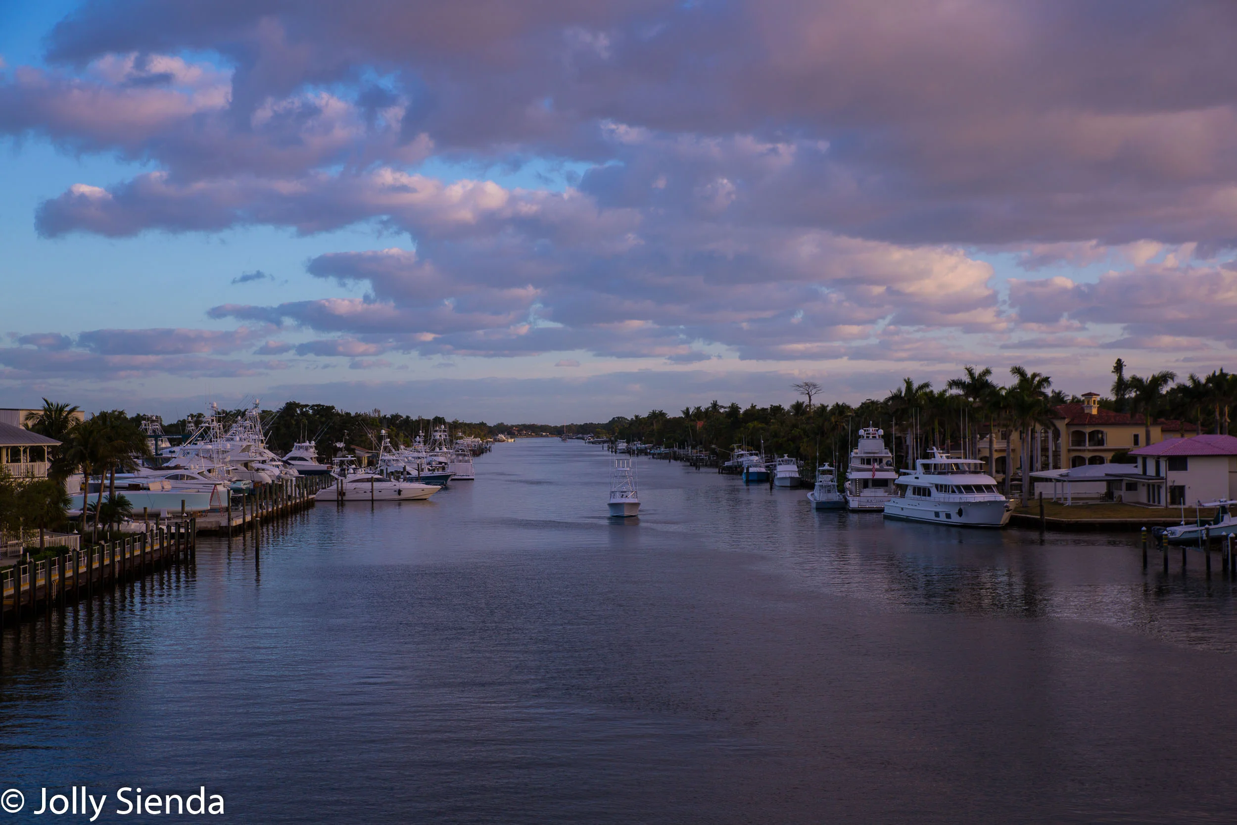 Pastel sunrise greets boats along the Atlantic Intracoastal Waterway, Palm Beach, Florida.