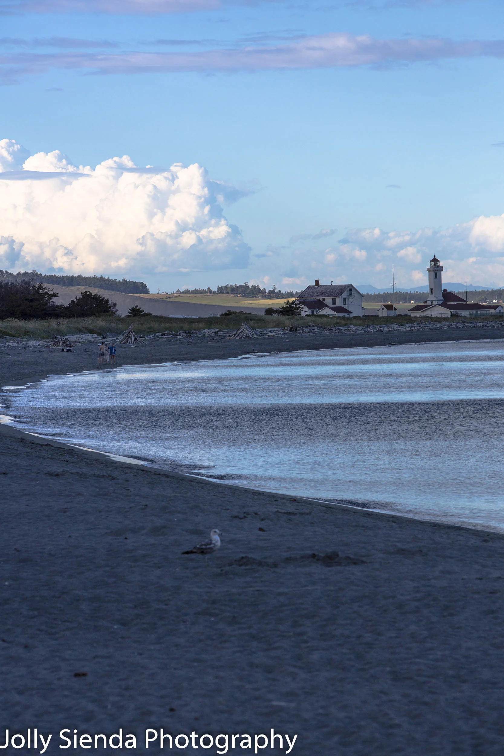 Dusk at curved beach at Point Wilson Light House